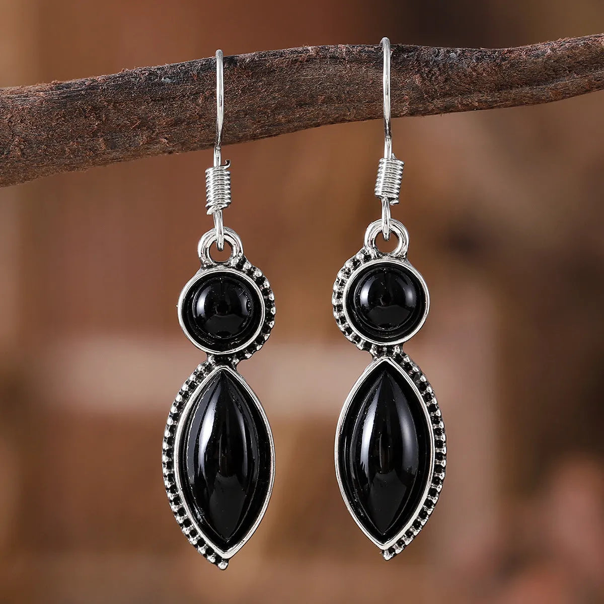 Geometric vintage earrings with black and purple gemstone accents in bohemian style