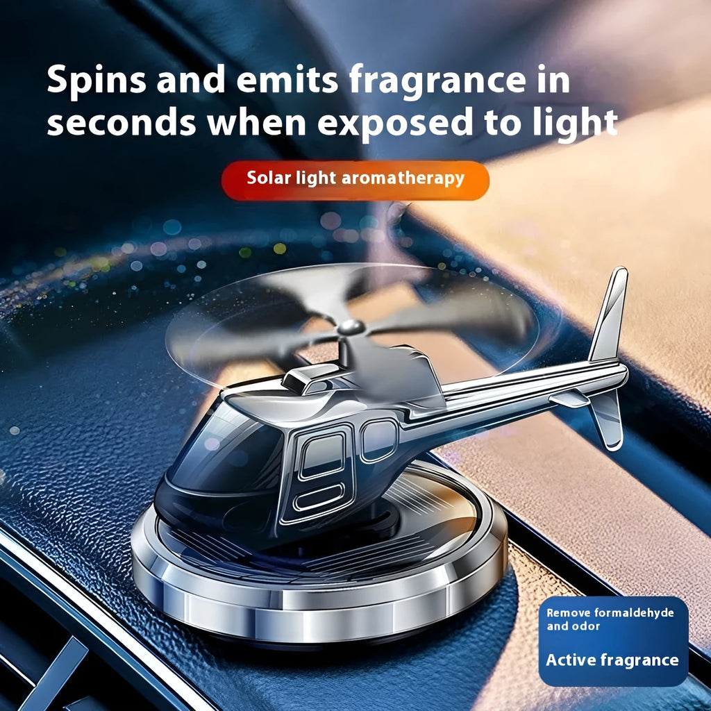Silver solar-powered metal helicopter car ornament with rotating blades and air freshener function.
