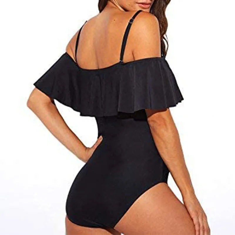 Black one-piece swimsuit with ruffled straps and side cut-out detailing.