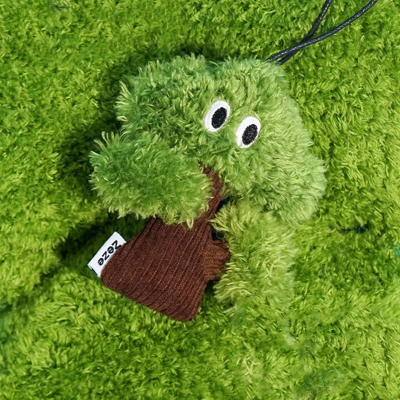 Green pine tree shaped fabric cat toy bag with hanging loop.