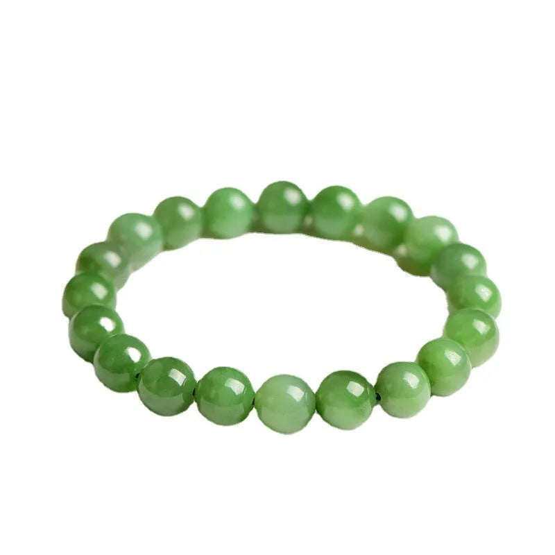 Polished Hetian jade bead bracelet in natural jasper colour on a wrist.