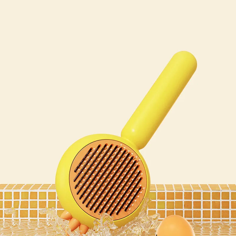 Pet grooming brush with self-cleaning feature and stainless steel bristles for cats and dogs