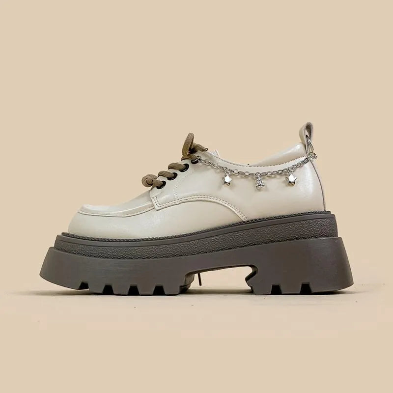 White PU platform Mary Jane shoes with thick chunky heel and front lace-up detail.