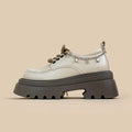 White PU platform Mary Jane shoes with thick chunky heel and front lace-up detail.