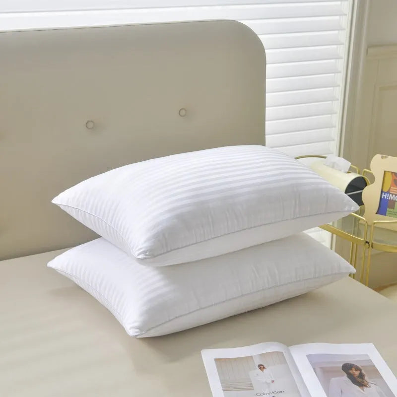 White cotton satin stripe pillow with feather filling in three size options for hotel or home use