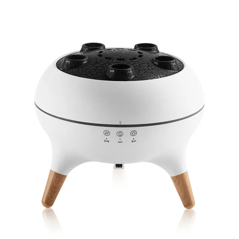 White jellyfish-shaped ultrasonic humidifier and aroma diffuser with remote control and timer on a table
