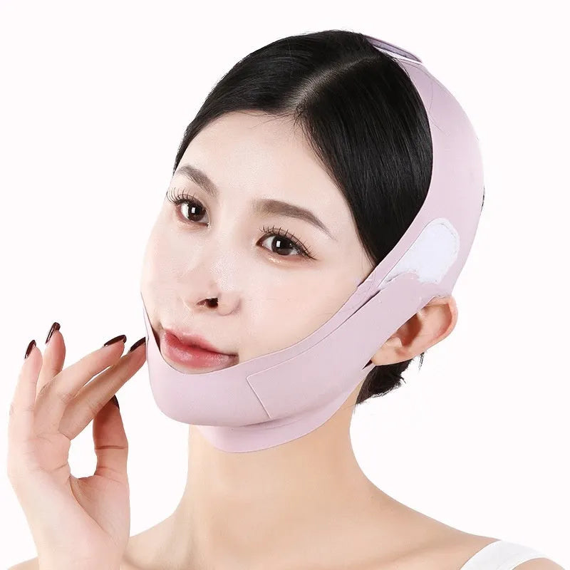 Small V face shaping mask in purple and green colours with breathable fabric construction