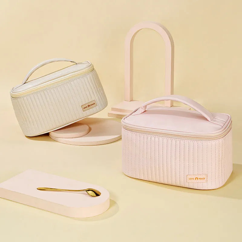 Open-top PU leather makeup bag in a solid colour from a choice of six options.
