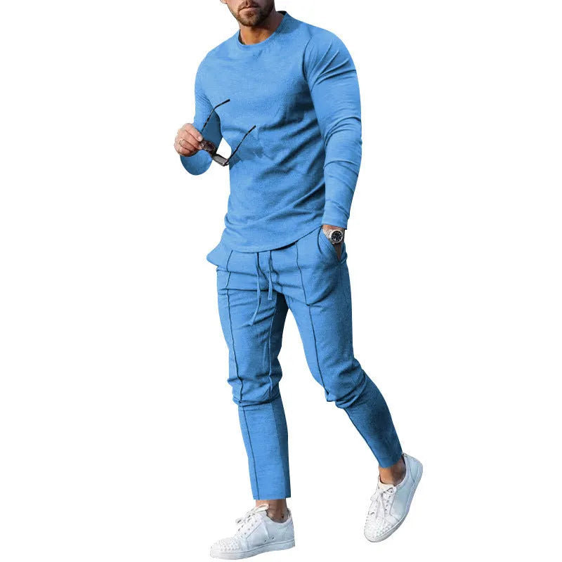 Men's light grey polyester two-piece suit with long sleeve t-shirt and trousers on a hanger.