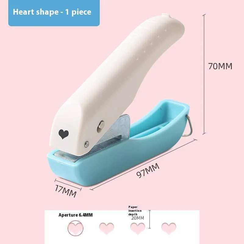 Small manual embossing punch tool showing Love, Star, and round hole shapes for paper crafts