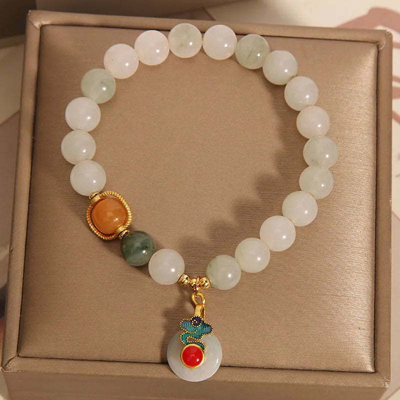 Women's ice jade crystal bracelet with pearl accents and a jade buckle on a retro design.