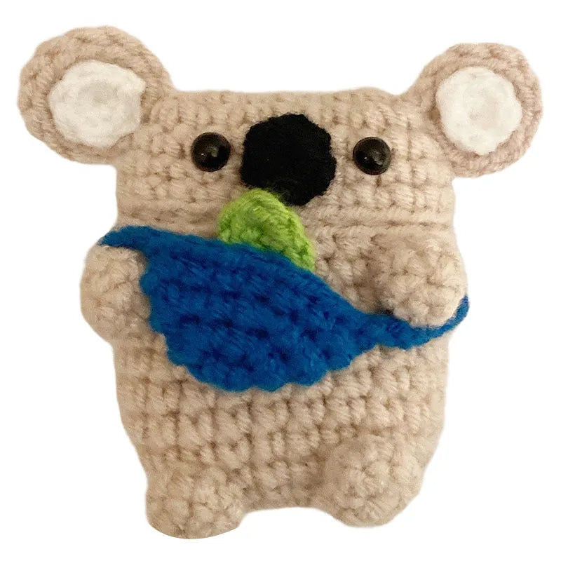 Handmade knitted AirPods protective cover with backpack koala bear design showing front and side views