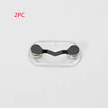 Black magnetic glasses holder attached to car dashboard with spectacles stored on bracket