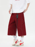 Retro multi-pocket denim shorts with wide leg cropped cut in black colour