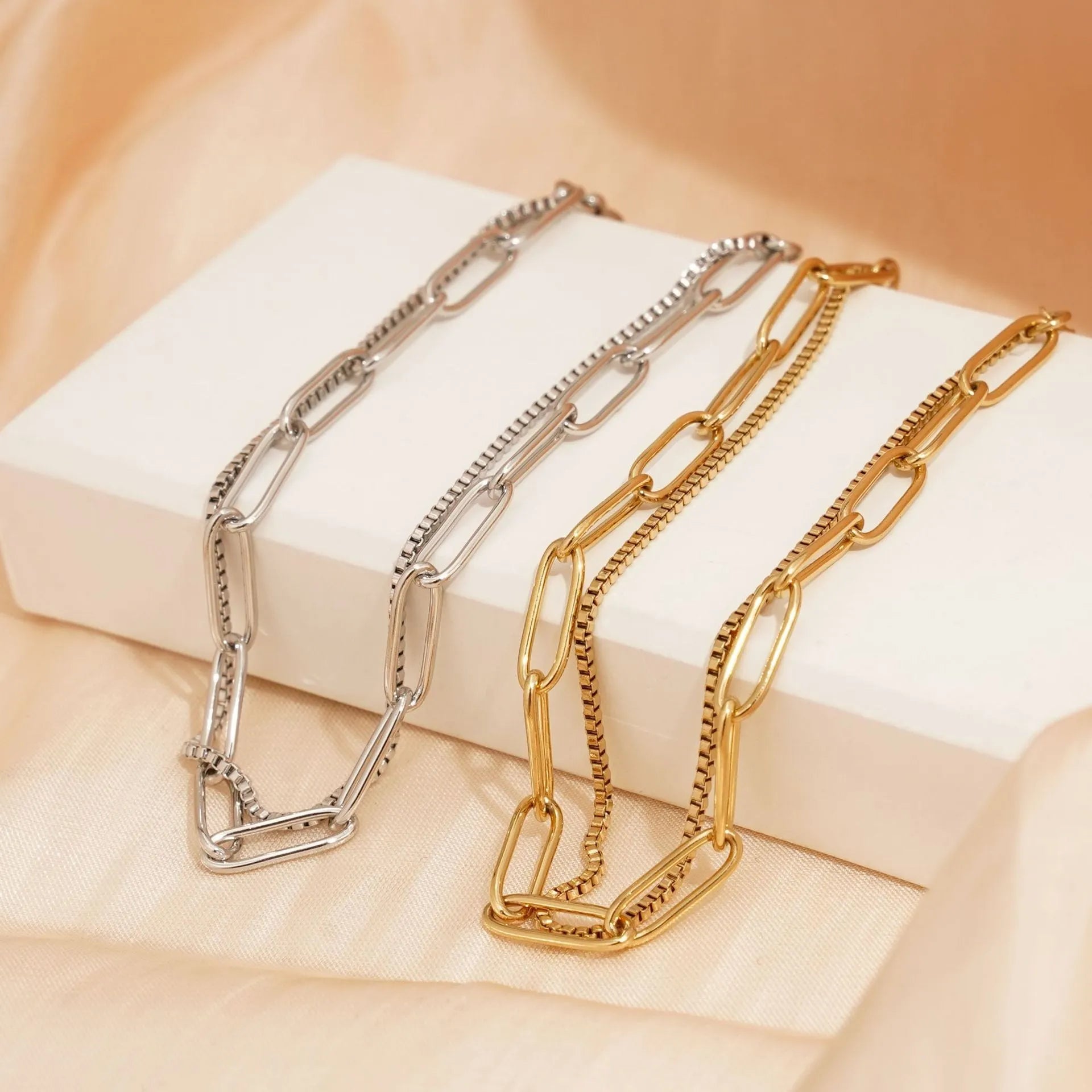 Geometric double layer stainless steel bracelet in gold or silver, showing Ins Cold Style design with linear elements.