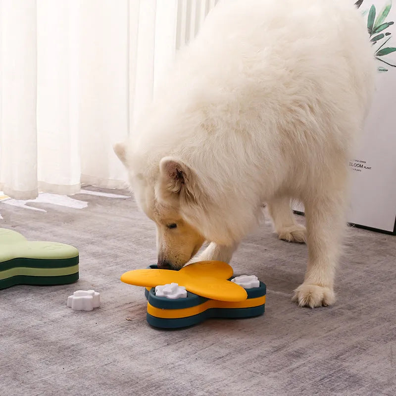 Green dog puzzle toy with bone-shaped covers showing nine compartments for treat dispensing