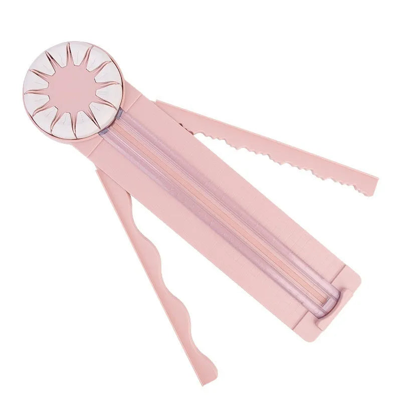 12-in-1 plastic paper cutting machine in pink colour on white background