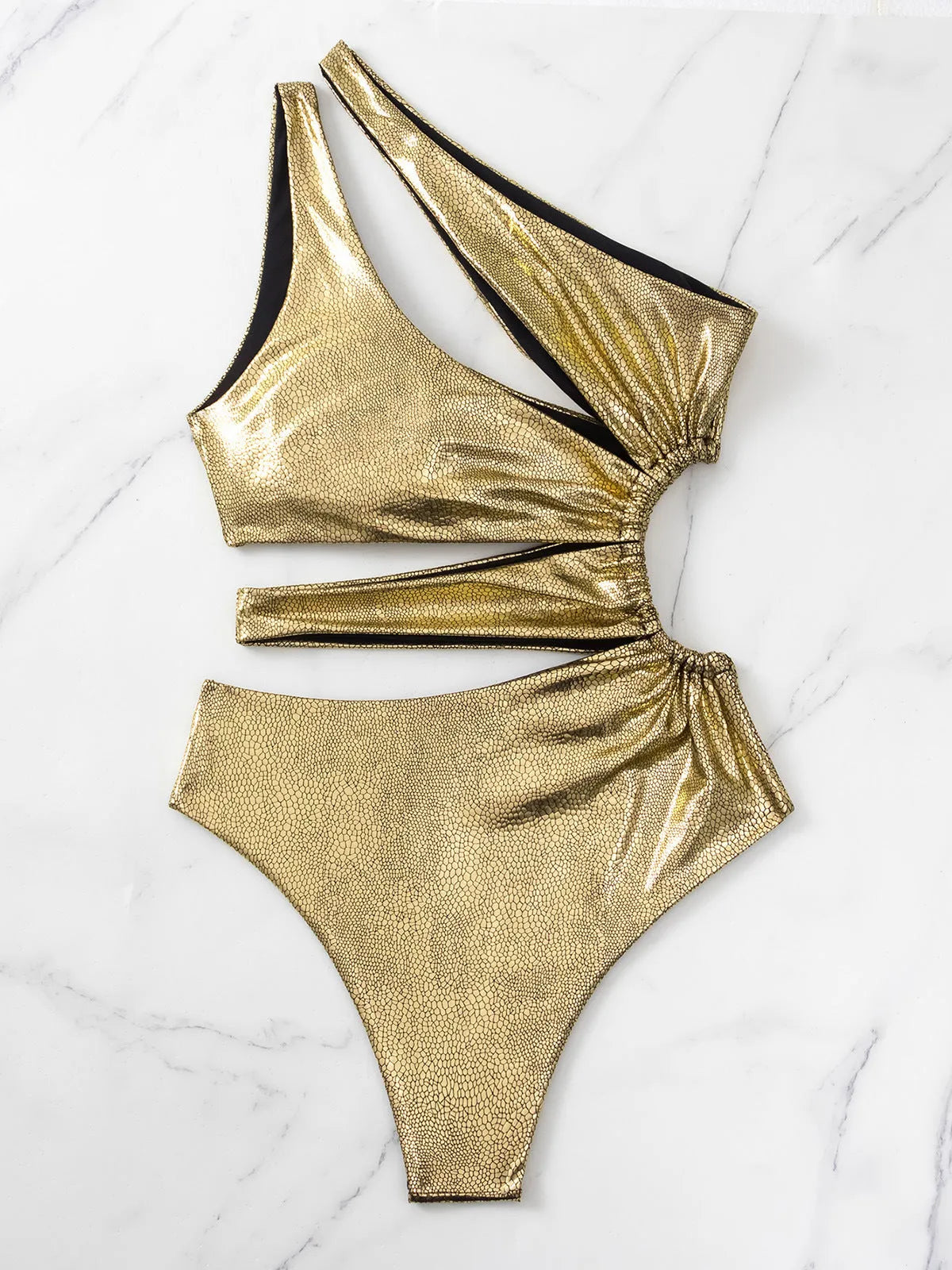 Women's gold backless one-piece swimsuit with spandex construction for swimming activities