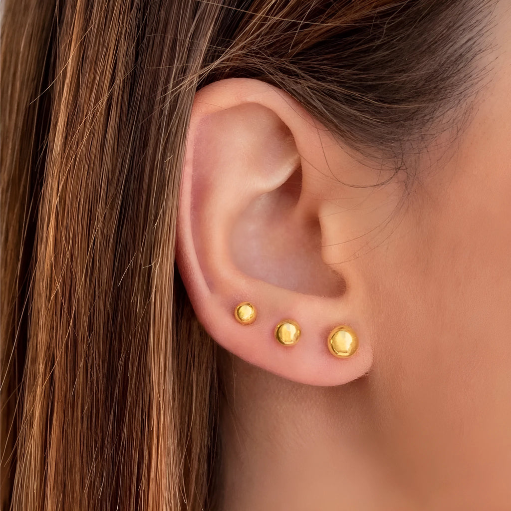 Stainless steel ball stud earrings with gold or silver plating in 3mm, 4mm, 5mm, and 6mm sizes