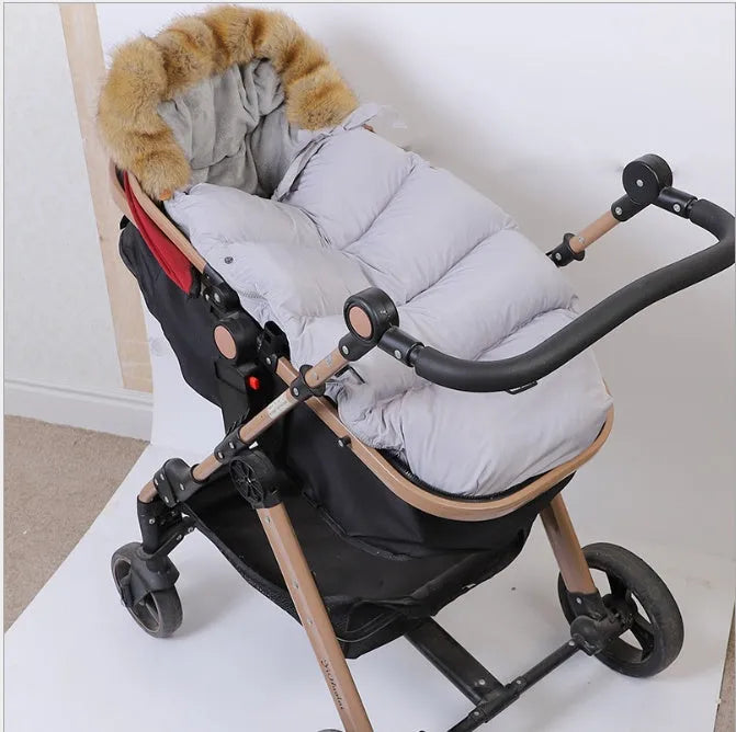 Baby stroller sleeping bag in polyester fibre with down cotton filling, measuring 46 by 95 centimetres, available in ten colours
