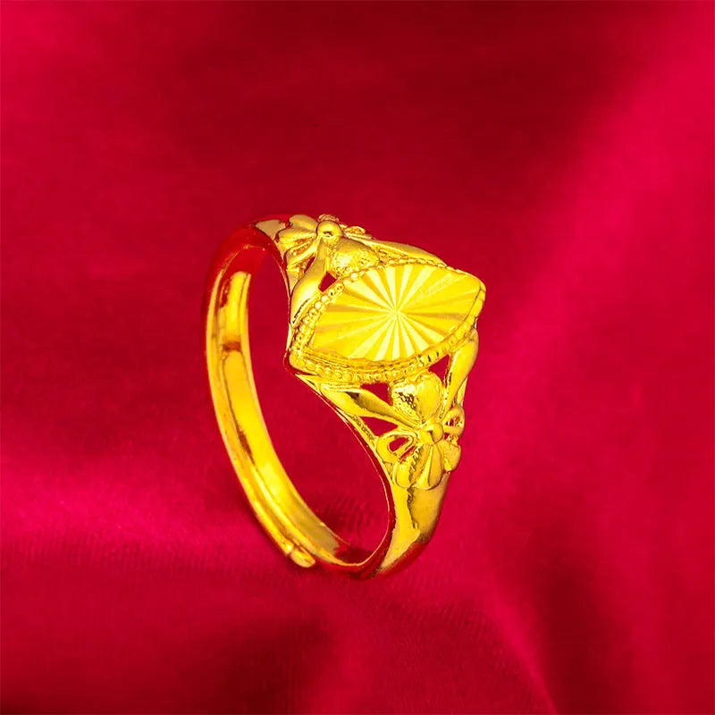 Gold-coloured brass flower ring with geometric texture and open diamond shape design