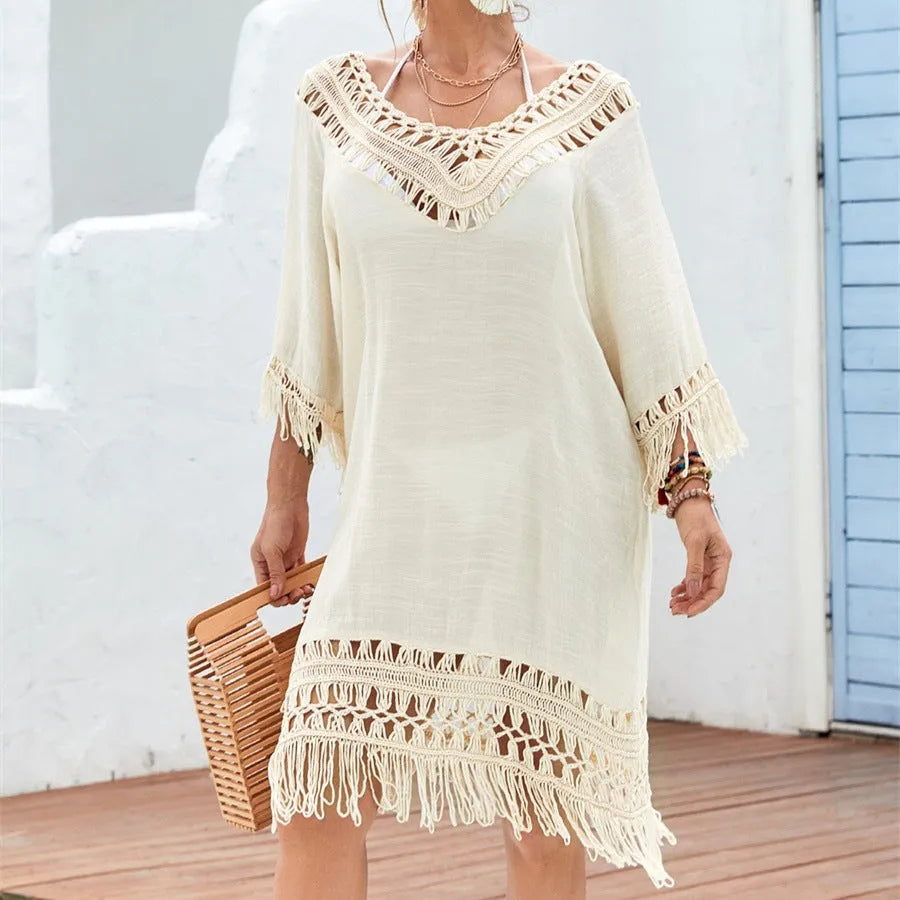 Apricot crocheted patchwork beach dress with half sleeves and mid-length skirt on hanger