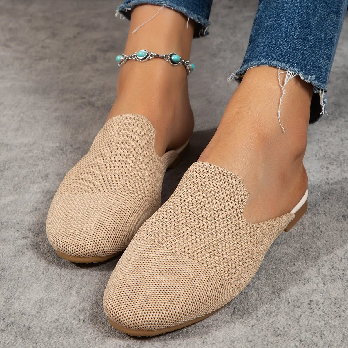 Mesh slip-on sandals in apricot, blue, and green with a cloth upper and flat rubber sole.