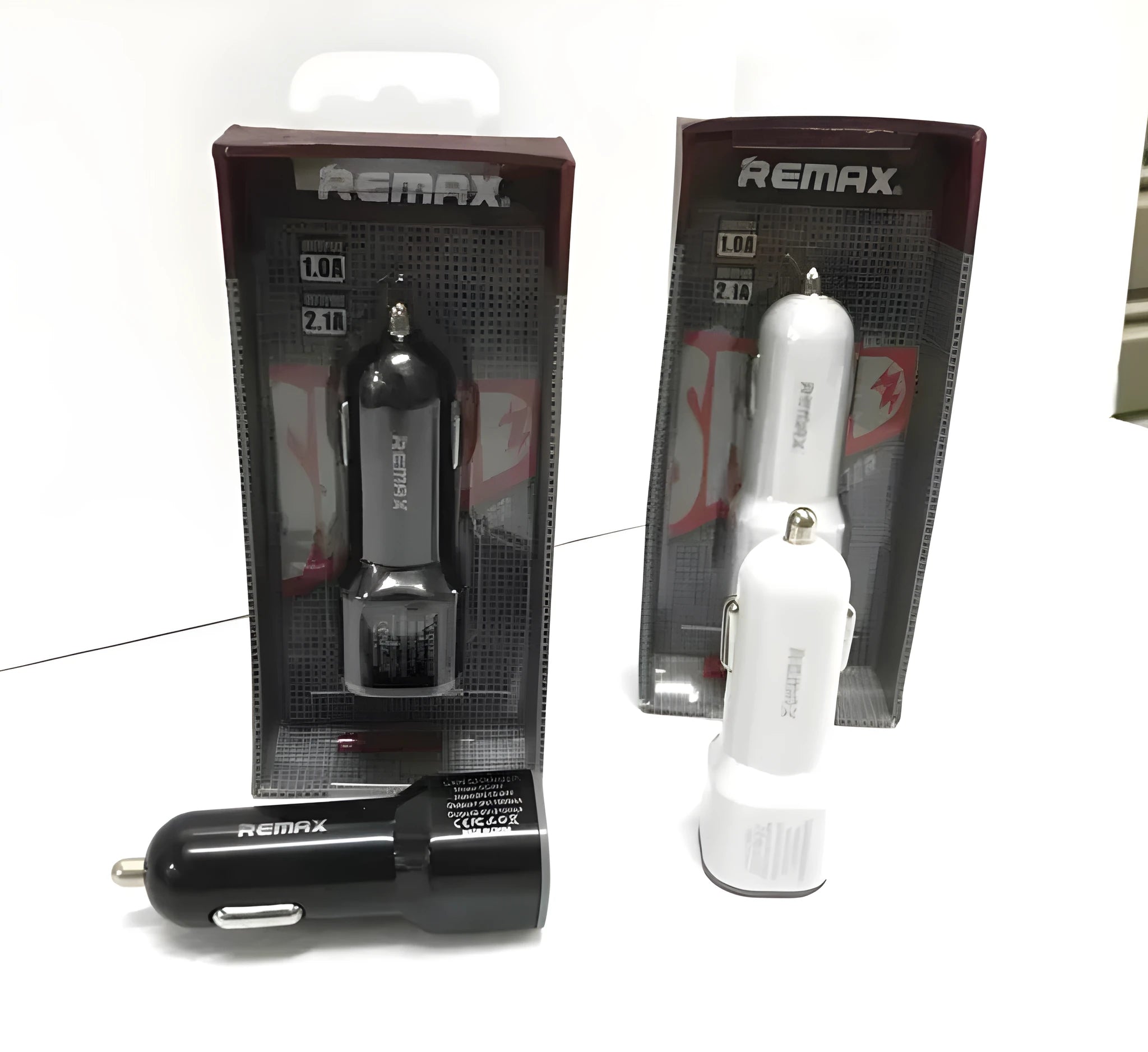 Car charger with dual USB ports in black colour, plugged into vehicle socket.