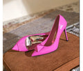 Pink patent leather women's stiletto high heels with pointed toe and buckle detail on a rubber sole.