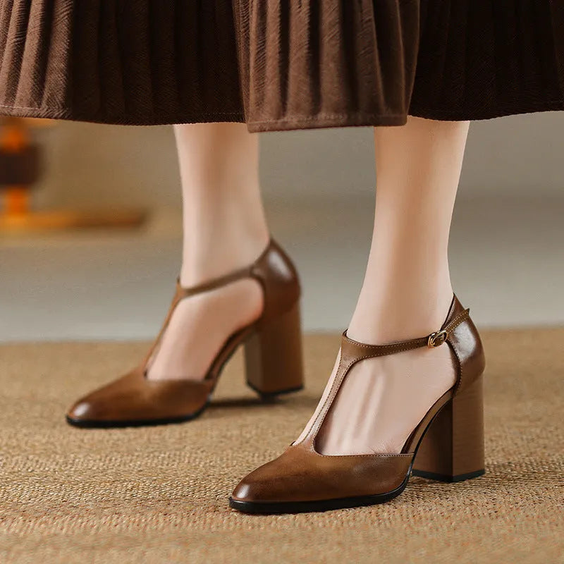 Women's dark brown retro pointed Mary Jane shoes with a hollow toe design and a buckle fastening.