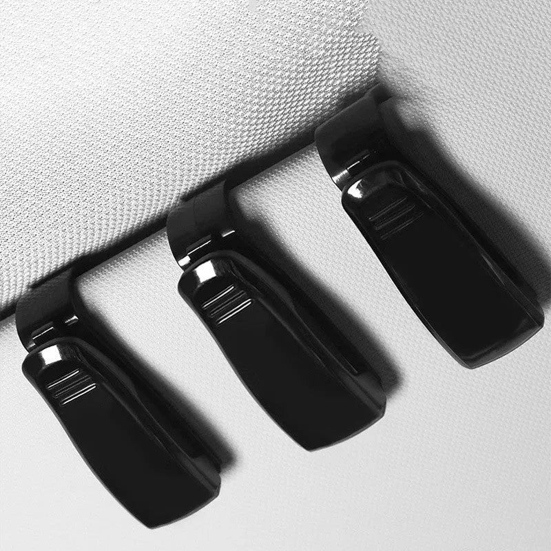 Black plastic clip for mounting sunglasses and cards on a car sun visor