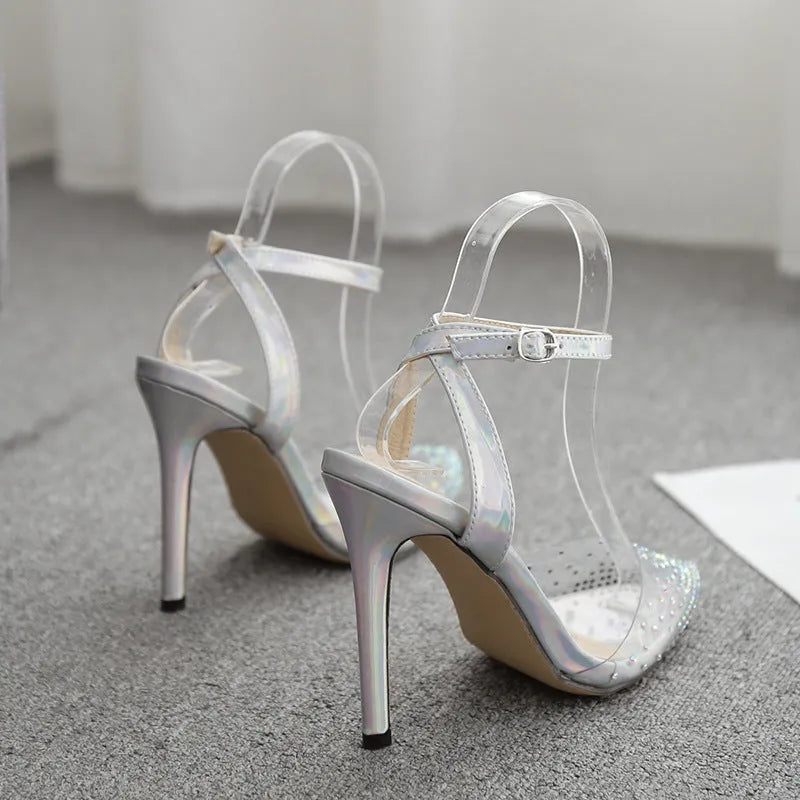 Women's pointed toe diamond sandals with a stiletto heel and PVC upper, shown in available sizes.