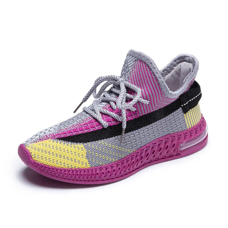 Women's purple low-top lace-up running shoes with round toe and plastic sole on a white background.