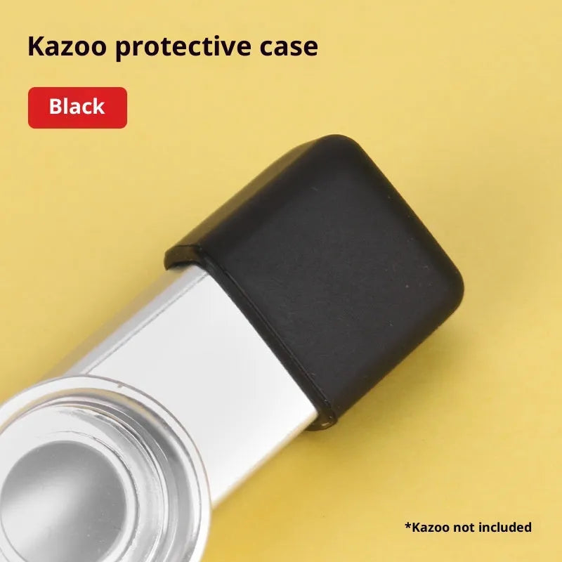 Metal kazoo in Flame Red with paper tube against a white background