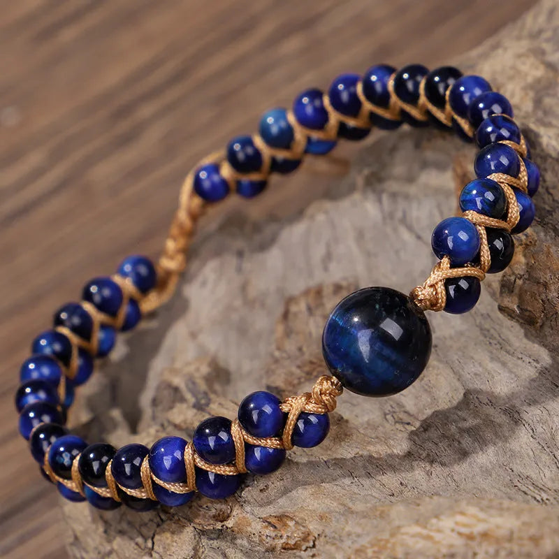Handmade woven geometric pull bracelet with blue tigereye stone beads.