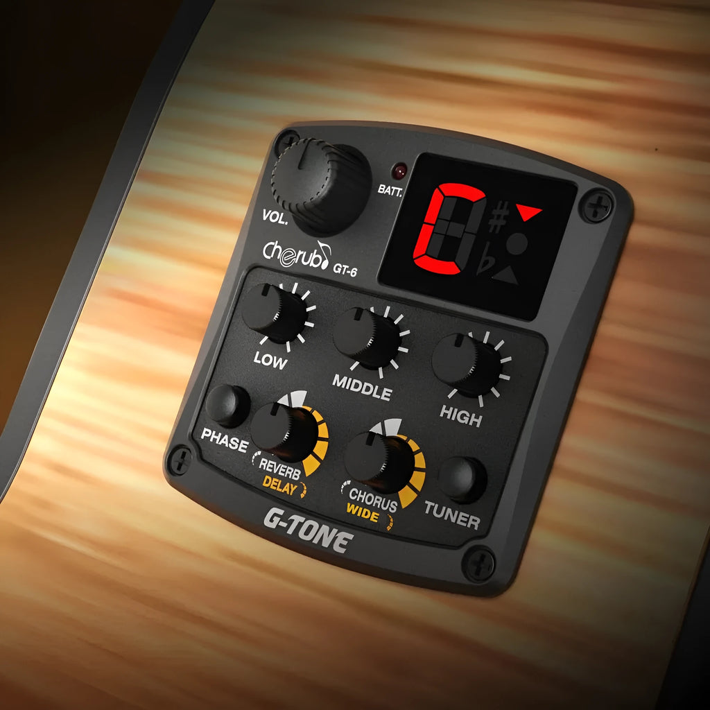Cherub GT-6 black acoustic guitar preamp with EQ and effects knobs mounted in a guitar soundhole.
