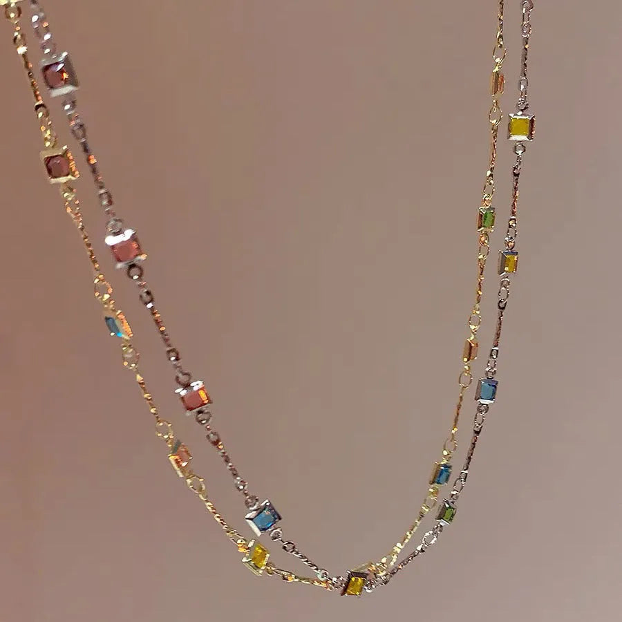 Square colour clavicle chain necklace with geometric crystal pendant in gold or white K finish.