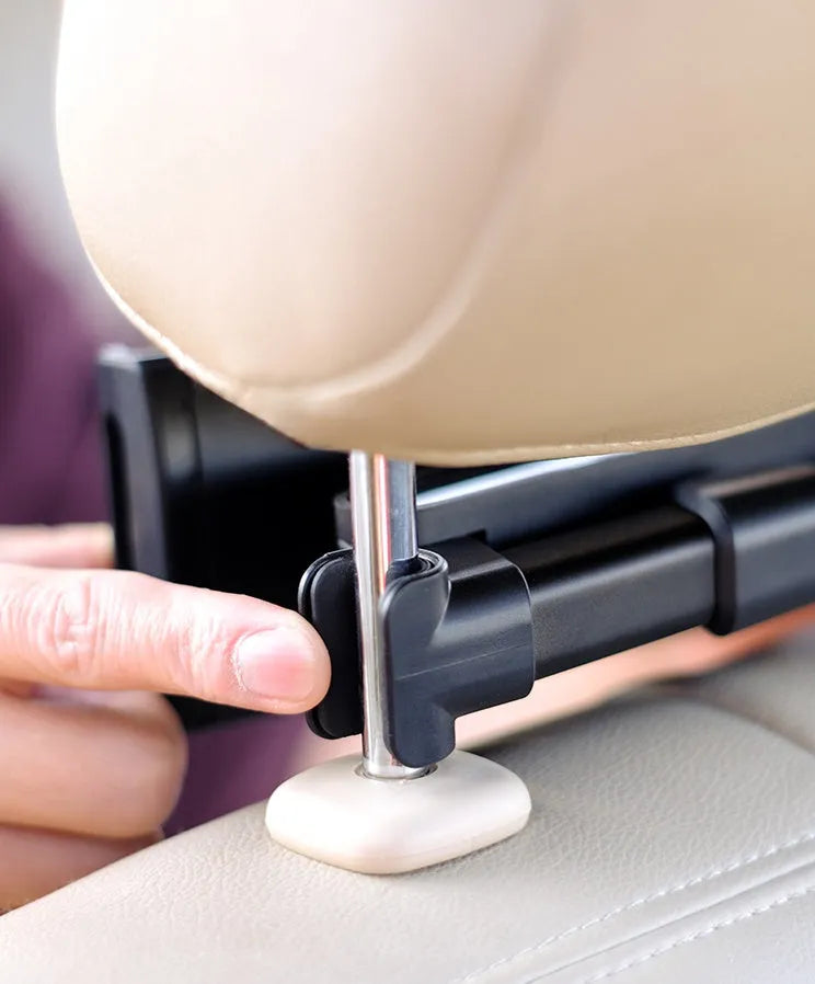Black universal car phone holder mounted on rear seat centre armrest with tablet secured in snap-in mount