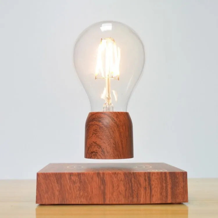 Magnetic levitation floating light bulb hovering above imitation wood base