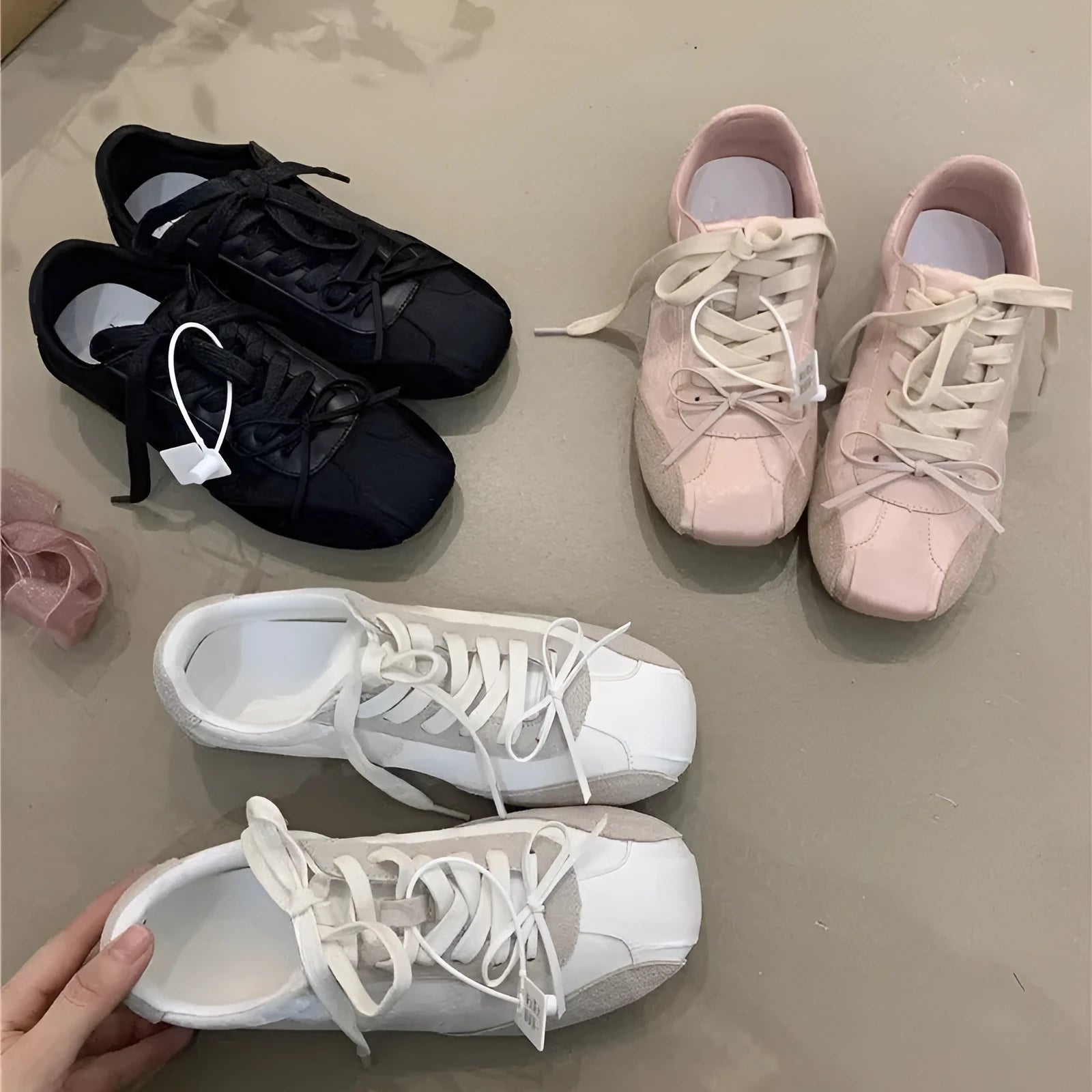 Girlish style bow white sneaker for women, low-top round toe, black colour option, side view