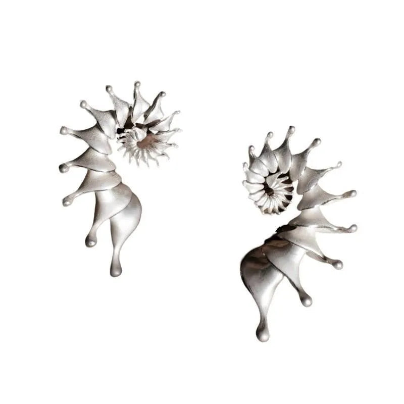 Matte finished conch stud earrings with three-dimensional alloy design