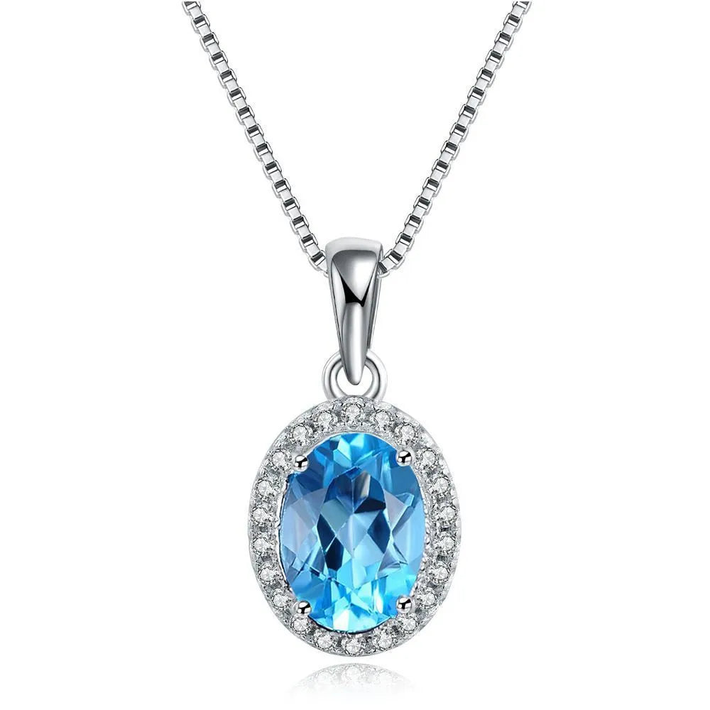 Geometric 925 sterling silver jewellery set with blue topaz stones, showing necklace, earrings, ring, and pendant.