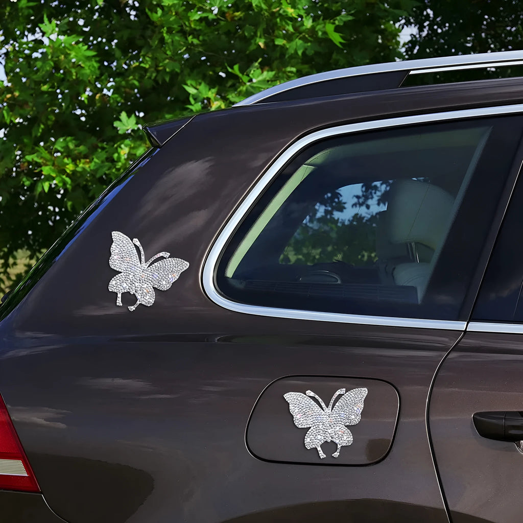 White diamond-encrusted glass car sticker with butterfly and bear claw design measuring 7x6 cm