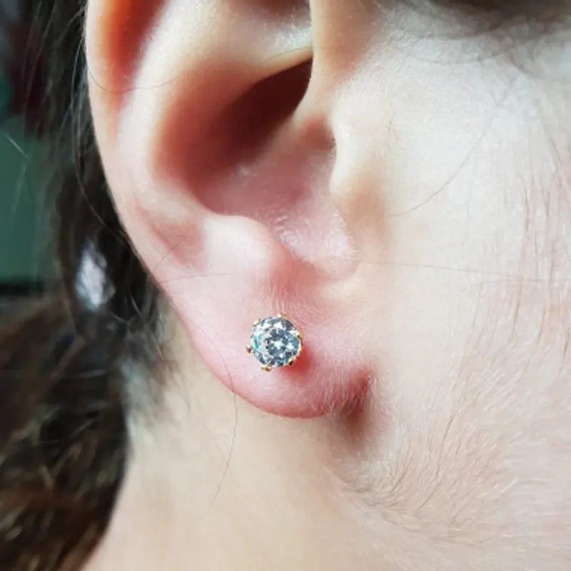 Disposable ear piercing gun with built-in crown stud in 316L stainless steel with zirconium inlay