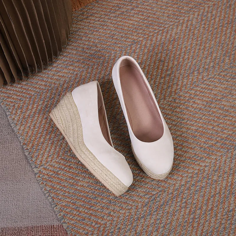 Women's wedge high heel pumps in apricot with rope detail on the heel and a shallow mouth opening.