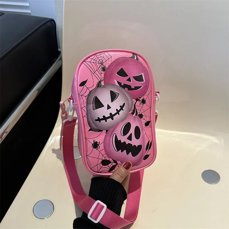 Halloween graffiti print crossbody bag with cartoon pumpkin ghost bat design in orange colour