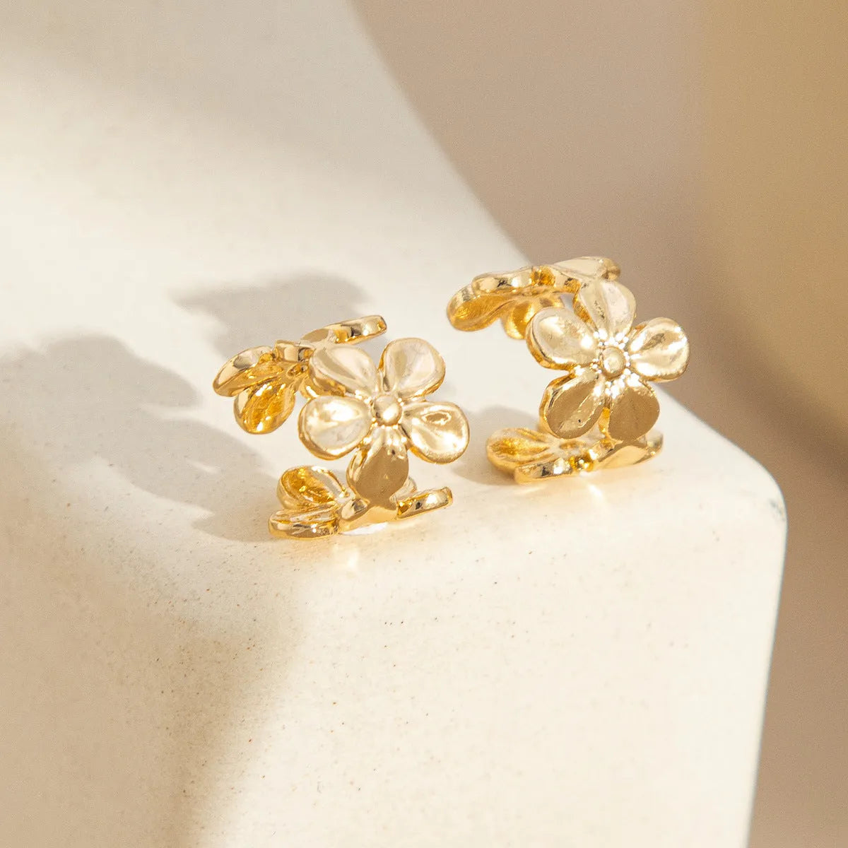 Gold starfish and scallop shell design women's earrings with electroplated finish
