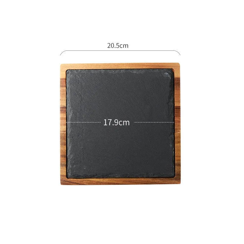 Black wooden pizza dish made from acacia wood and stone, multi-colour sets, on a table