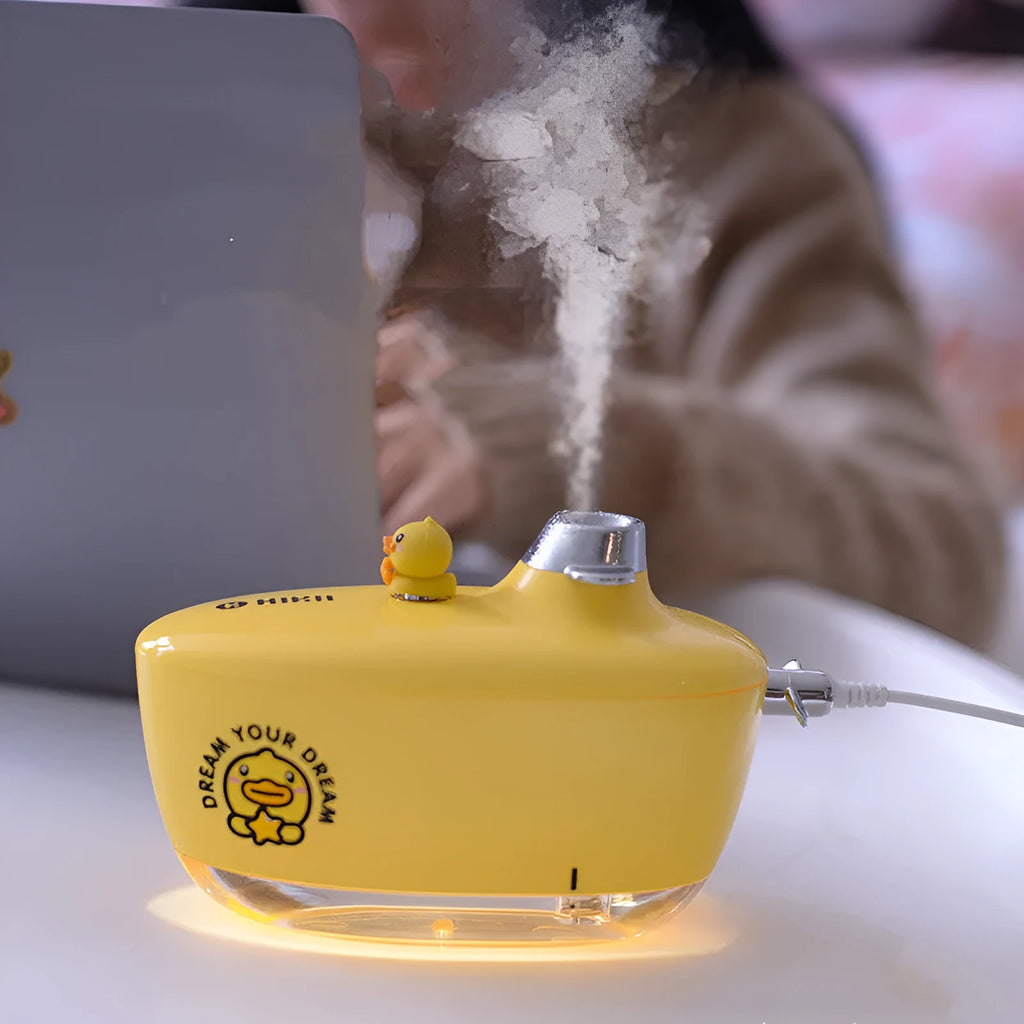 USB small mini portable air purifying humidifier with night light in green, pink, yellow options on desk