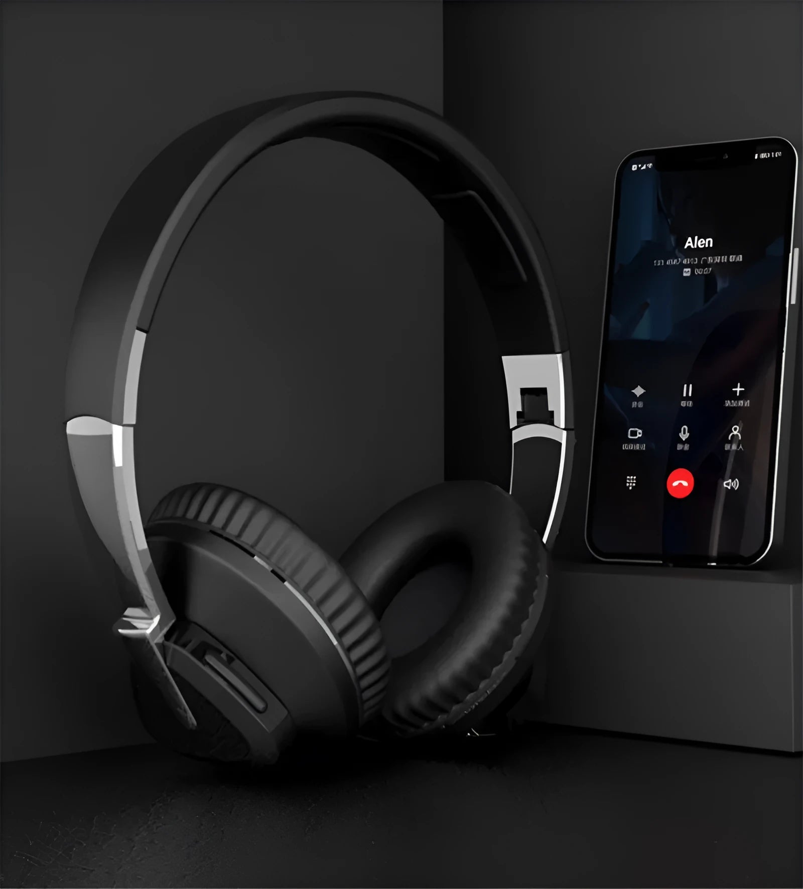 Wireless over-ear headset in black with soft ear cushions, showing AUX audio jack port.
